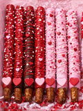 Customized dipped pretzel rods and Rice Krispie pops